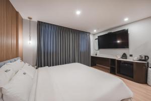 Hotel Palace Gyeongju客房内的一张或多张床位