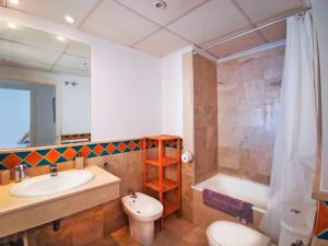 a bathroom with a sink and a toilet and a shower at Banana Beach in Marbella