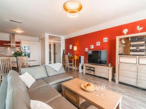 a living room with a couch and a table at Villa Friede-Marie, Ostseeweitblick in Sassnitz