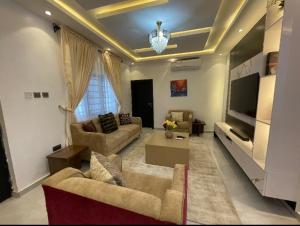 Posezení v ubytování HOMEWORTH SPACES - Shortlet Apartmemt