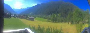 a view of a green field in front of a mountain at Ferienappartement in Gortipohl +12 photos
