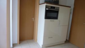 Kuchyň nebo kuchyňský kout v ubytování Ferienwohnung Müritzbrise Groß In In Ludorf
