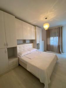 Ένα ή περισσότερα κρεβάτια σε δωμάτιο στο Beach House Apartment