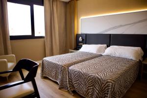 Postel nebo postele na pokoji v ubytování Hotel Benetusser