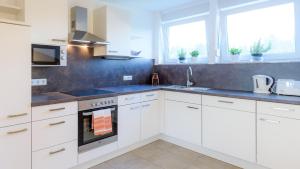 Kuchyňa alebo kuchynka v ubytovaní Appartement In Unterburg Am Klopeiner See