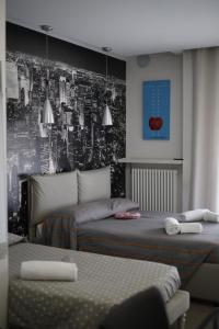 Postel nebo postele na pokoji v ubytování SMILE ACCOMODATION AOSTA