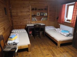 Postel nebo postele na pokoji v ubytování Chalupa Adélka