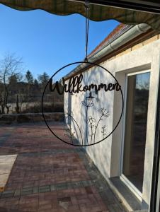 a sign that reads willremember hanging outside of a window at Ferienhaus In Berkenlatten Mit Großer Terrasse in Gerswalde
