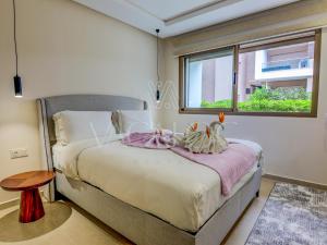 En eller flere senge i et værelse på La Ola - Piscine - Luxe - 2 or 4 Px