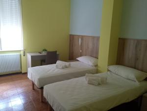 Postel nebo postele na pokoji v ubytování Hotel Garden
