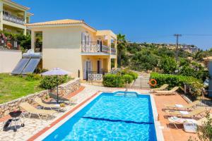 an image of a villa with a swimming pool at Skala Villa Yellow in Skala Kefalonias