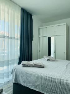 Postel nebo postele na pokoji v ubytování Green Paradise apartments