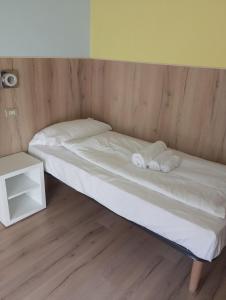 Postel nebo postele na pokoji v ubytování Hotel Garden