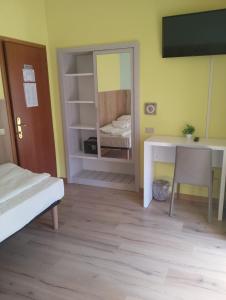 Postel nebo postele na pokoji v ubytování Hotel Garden