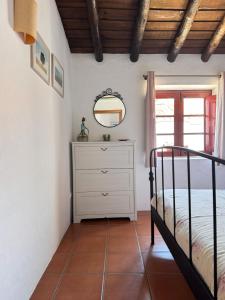 En eller flere senge i et værelse på Casa Oliveira - Casas da Amieira