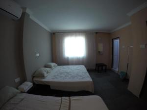 Ein Zimmer in der Unterkunft Na'iim Budget Hotel