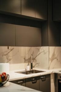 a kitchen with a sink and a counter at Damast Lux apartments 20 in Ohrid