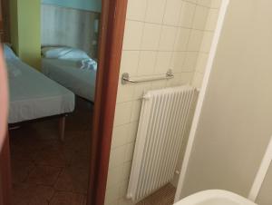 Postel nebo postele na pokoji v ubytování Hotel Garden