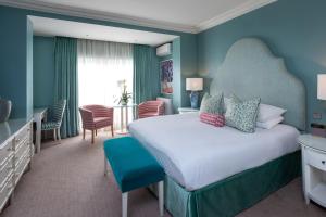 a hotel room with a large bed in a room at Roslin Beach Hotel in Southend-on-Sea