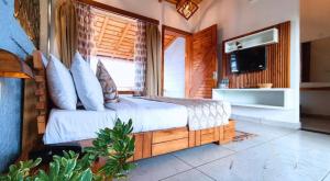 KK Jungle View Resort的电视和/或娱乐中心