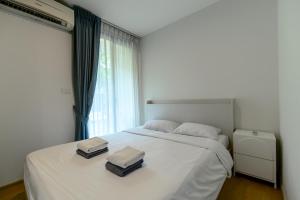 Ένα ή περισσότερα κρεβάτια σε δωμάτιο στο Zcape 2 Phuket by RESAVA