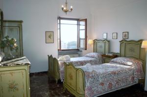 Posteľ alebo postele v izbe v ubytovaní Chalet Villa Ornella