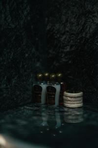 two blue and white bottles sitting on top of a table at Damast Lux apartments 20 in Ohrid