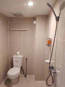 a bathroom with a toilet and a shower at Chilli House Residence in Patong Beach +16 photos