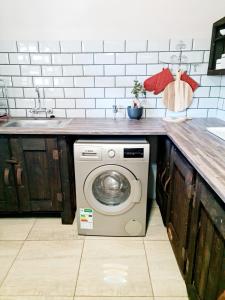 Η κουζίνα ή μικρή κουζίνα στο B&B Accommodation 109 Bezuidenhout