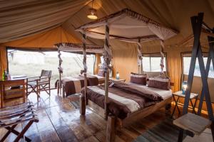Postel nebo postele na pokoji v ubytování Mawe Tented Camp