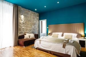 Posteľ alebo postele v izbe v ubytovaní Riva Luxury Rooms