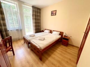 Posteľ alebo postele v izbe v ubytovaní Parkowa Rezydencja Hubal