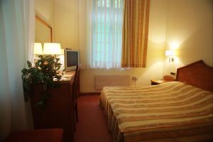 Katil atau katil-katil dalam bilik di Garni Hotel Park