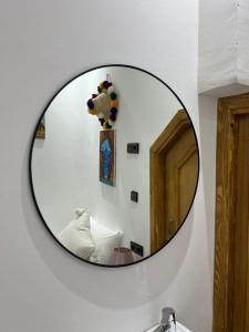 a mirror on a wall in a room at Chambre au cœur de la médina avec salle de bain privé in Tangier