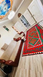 a bed on the floor in a room at Guest House Ormon in Ak-Muz