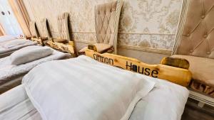a row of beds sitting in a room at Guest House Ormon in Ak-Muz +52 photos