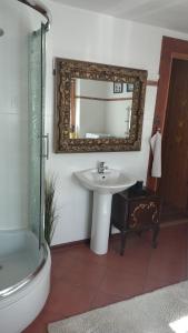 a bathroom with a sink and a mirror at Zacisze in Kościelisko