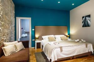 Posteľ alebo postele v izbe v ubytovaní Riva Luxury Rooms