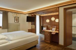 Voodi või voodid majutusasutuse Hotel Al Sonnenhof toas