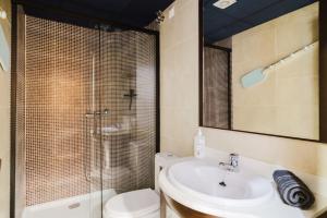 a bathroom with a sink and a shower and a toilet at Chillout Grau de Gandia- attico para 6 personas dos banos VT-44956-V in Gandía