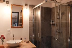 a bathroom with a glass shower and a sink at Po Prostu Dobro in Mrągowo +19 photos