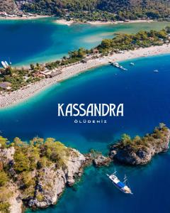 an aerial view of a island with a boat in the water at Kassandra Oludeniz in Oludeniz