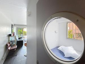 Ένα ή περισσότερα κρεβάτια σε δωμάτιο στο Le Jardin d 'Emma