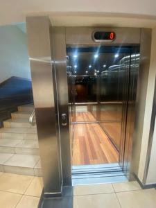 an elevator in a building with a bowling alley at Wave and Sun Apartment in Hel