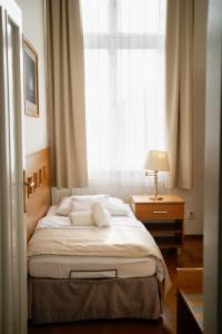 Postel nebo postele na pokoji v ubytování Hotel Pod Zeleným Dubem