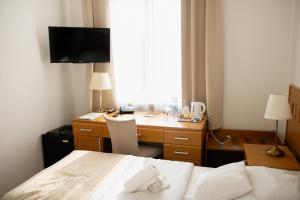Postel nebo postele na pokoji v ubytování Hotel Pod Zeleným Dubem