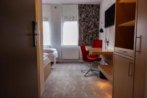 Postel nebo postele na pokoji v ubytování Frederik VI's Hotel