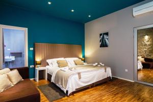 Posteľ alebo postele v izbe v ubytovaní Riva Luxury Rooms