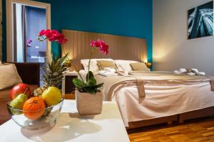 Posteľ alebo postele v izbe v ubytovaní Riva Luxury Rooms