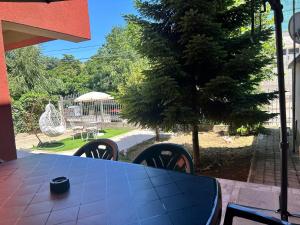 a blue table and chairs on a patio at Къща за гости STEDY in Chernomorets +85 photos